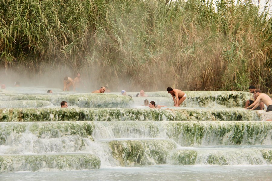 Warm thermal water cascading over travertine at Saturnia
