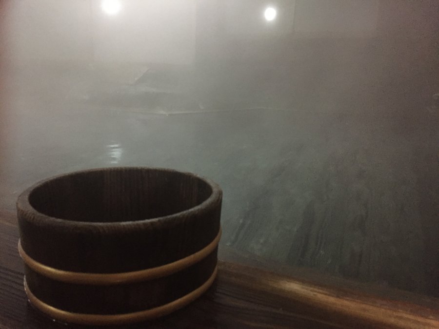 The low washing stations beside a Japanese onsen bath