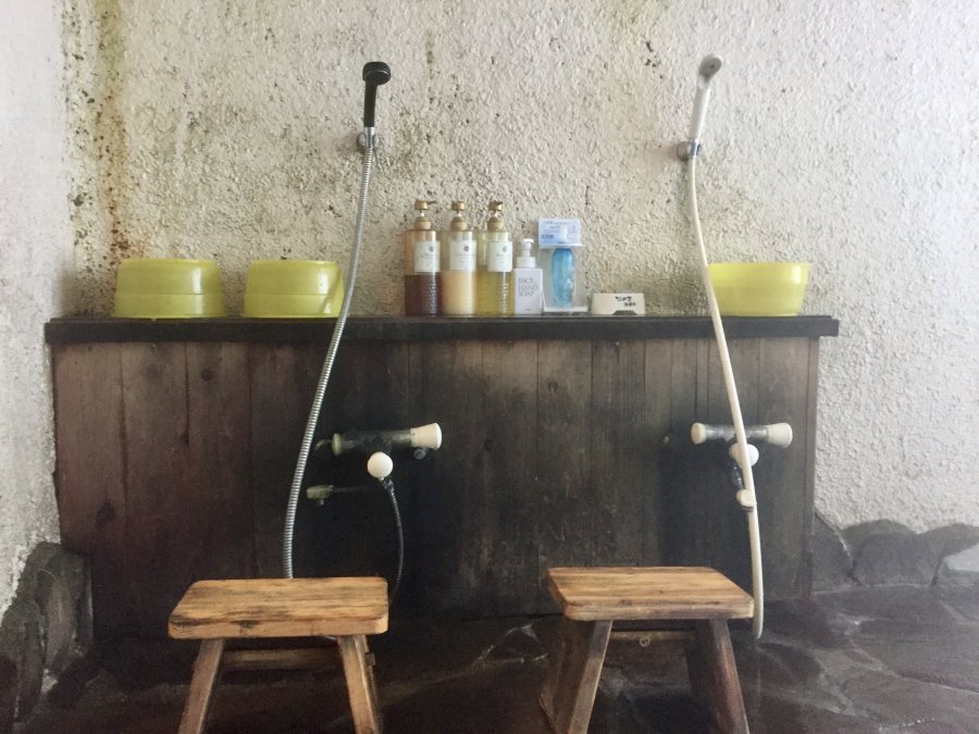 The low washing stations beside a Japanese onsen bath