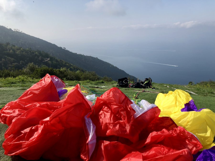 Preparing to launch a tandem paraglider above Monterosso