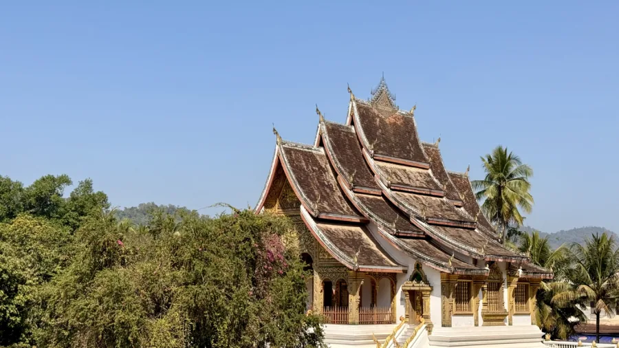 Gilded temple and teak halls in the old town of Luang Prabang
