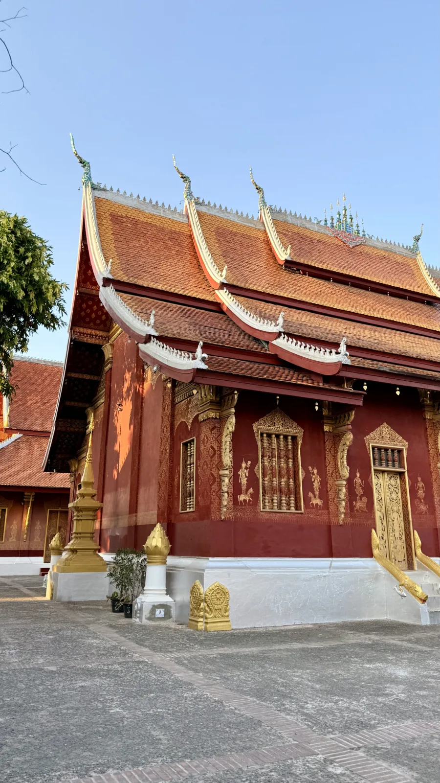 Gilded temple and teak halls in the old town of Luang Prabang