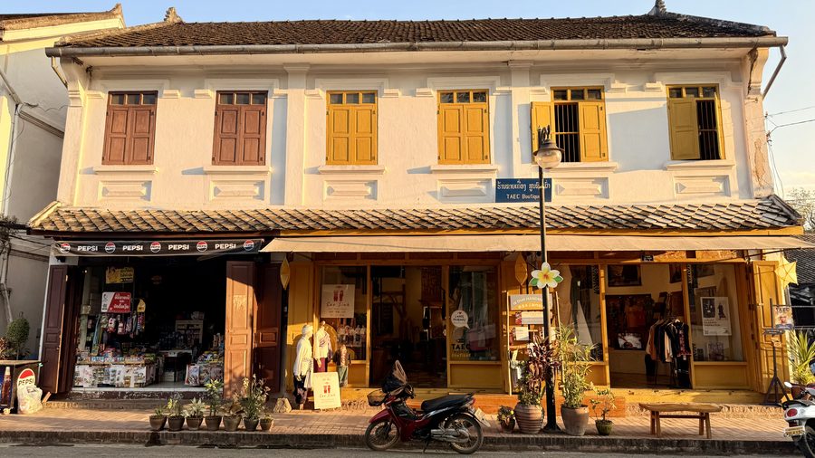 Faded shutters and tamarind shade in the French colonial quarter of Luang Prabang