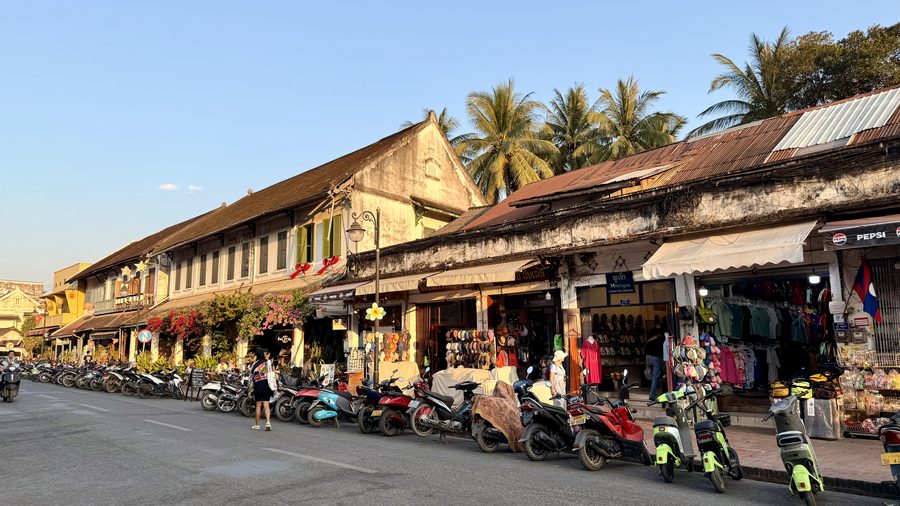 Faded shutters and tamarind shade in the French colonial quarter of Luang Prabang