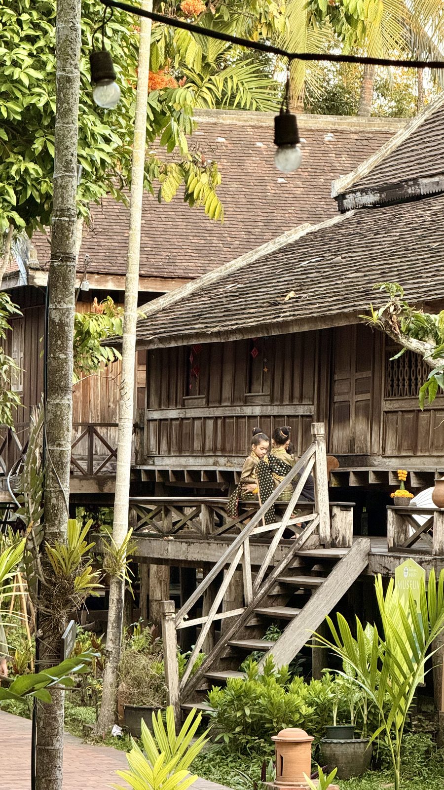 Faded shutters and tamarind shade in the French colonial quarter of Luang Prabang