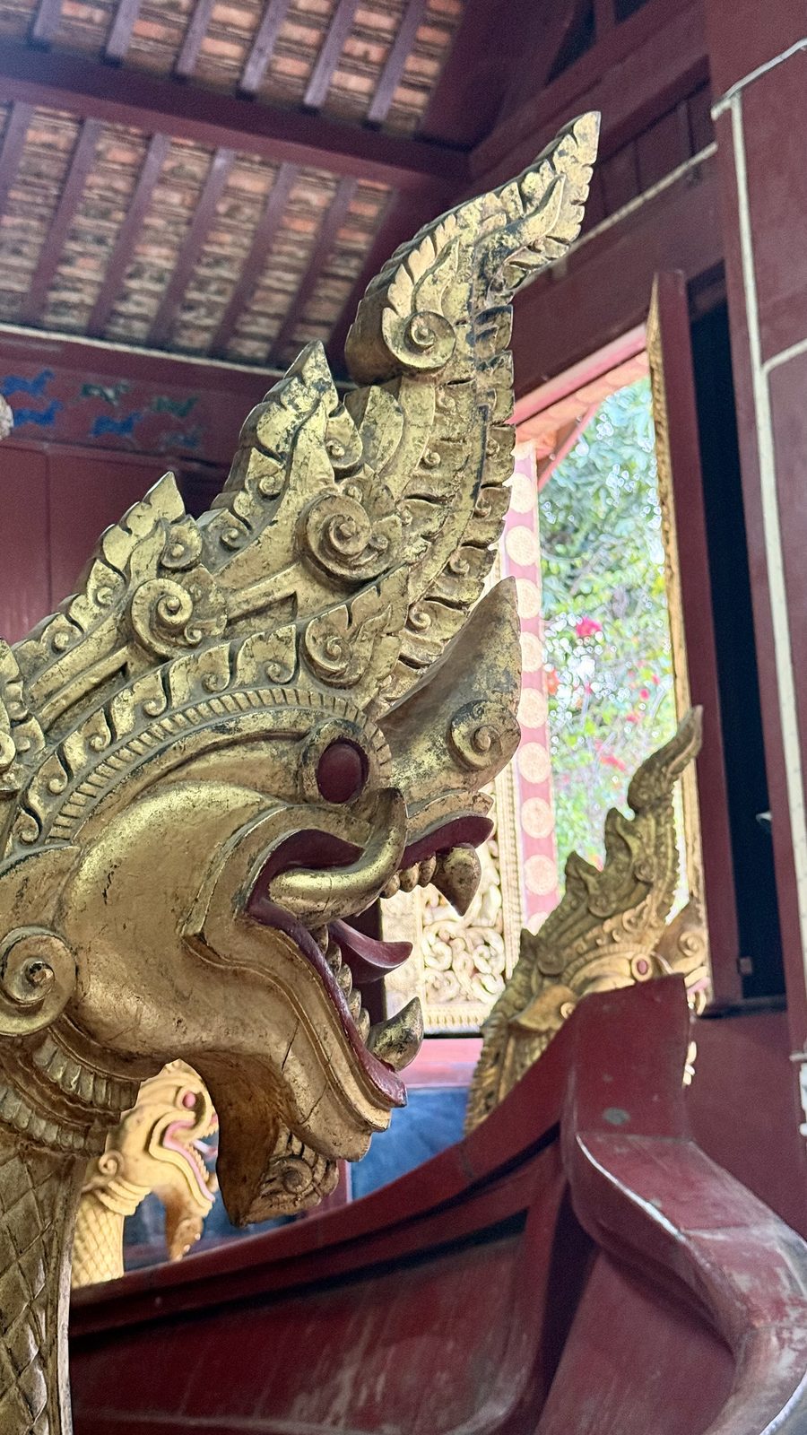 Gilded temple and teak halls in the old town of Luang Prabang