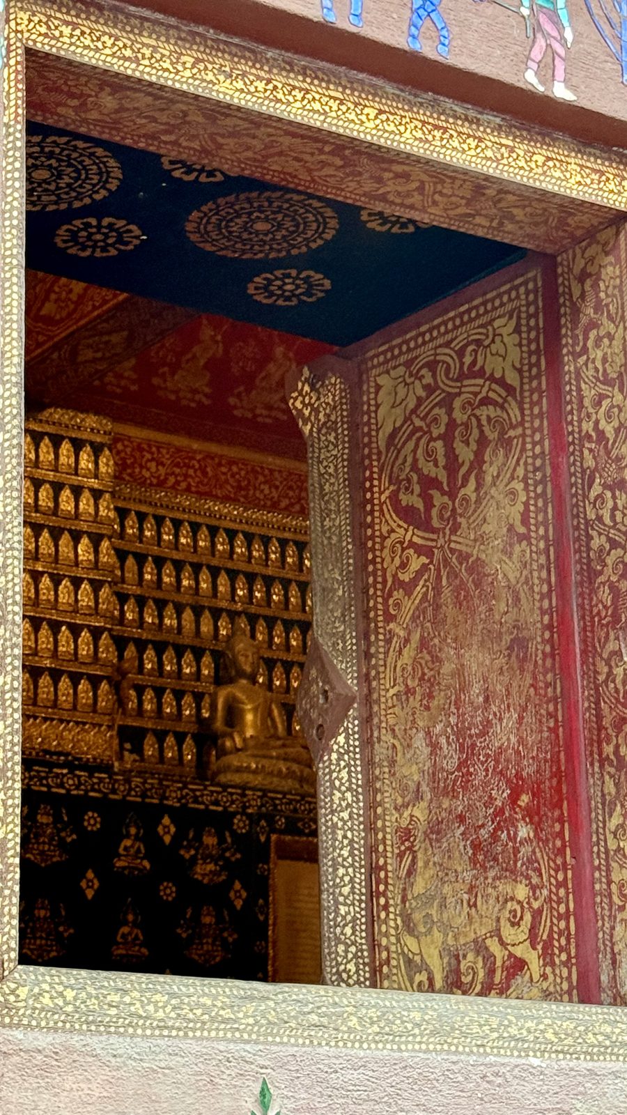 Gilded temple and teak halls in the old town of Luang Prabang